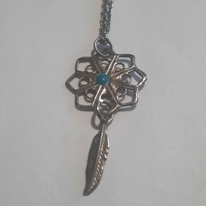 Dream catcher necklace with a dangling feather